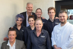 Paul Taberner & staff with Andrew Gaze and Craig Bellamy